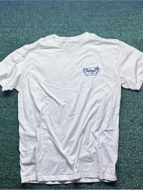 Pelagic White Short Sleeve Logo Tee with Blue Chest Emblem